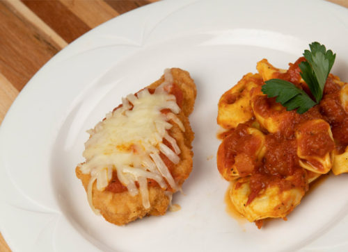 Pork cutlet Parmesan with Tortellini Napolitana